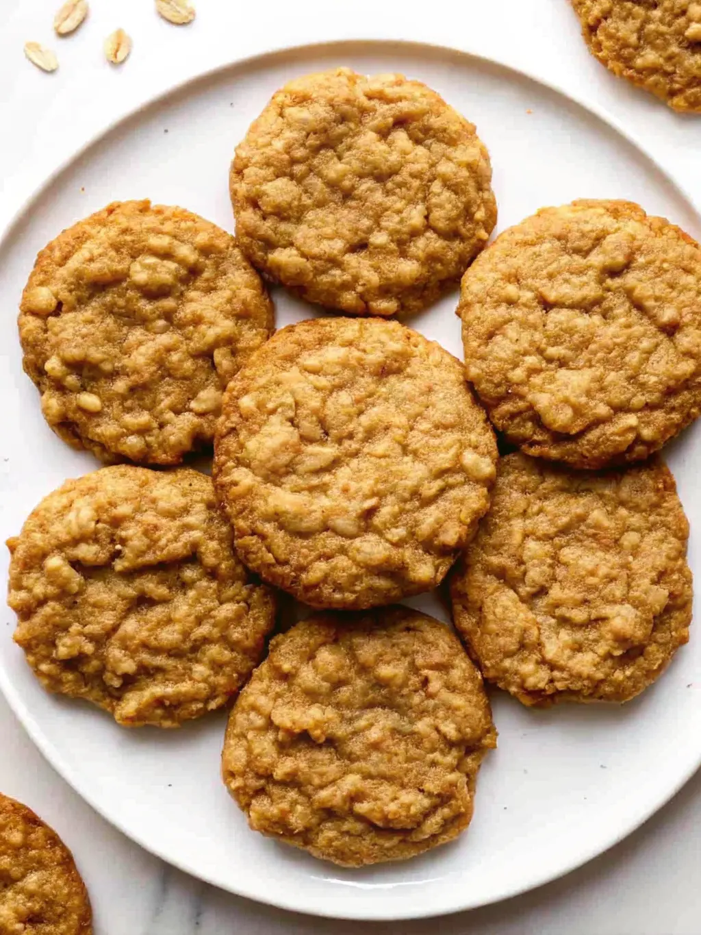 Chewy oatmeal cookies on cooling rack.