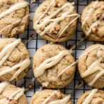 Soft maple cookies with glaze on a wooden table.