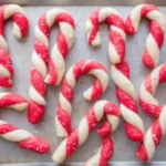 Perfectly twisted Candy Cane Cookies with sparkling sugar