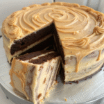 Slice of salted caramel mocha cake showing moist mocha layers and salted caramel buttercream filling.