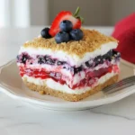 Close-up macro of Red White & Blue Mixed Berry yum yum showing rich fruit layers and creamy topping.